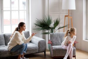 A mother points a finger at their child who is sitting facing away from her. This could represent the disruptive behavior that child counseling in Boulder, CO can address. Learn more about the help an anxiety therapist in Boulder, CO can offer by searching for best therapists in Boulder today. 
