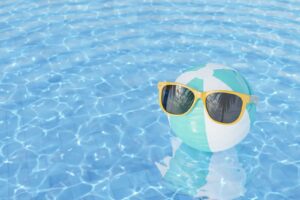 A beach ball with sunglasses floats in a pool. This could represent the summer months that can still cause depression. Contact a depression therapist in Boulder, CO to learn more about overcoming depression symptoms in Boulder, CO today. Search for depression treatment in Boulder, CO today. 