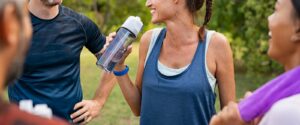 A group of friends smile while talking after a morning run. learn how connecting with others can help you address anxiety by contacting an anxiety therapist in Boulder, CO. They can offer support with stress symptoms in Boulder, CO via anxiety treatment today.